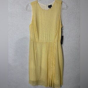 The Savile Row Dress This is a beautiful yellow dress with small print.